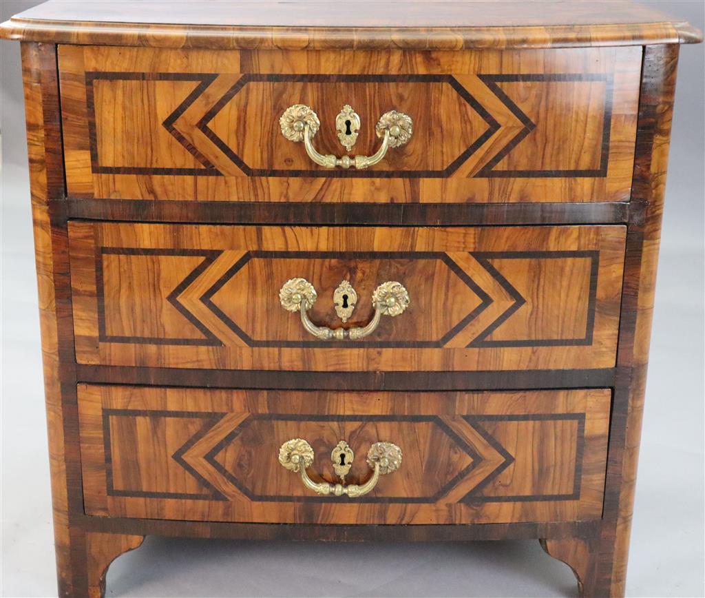 A French Regence olivewood and rosewood bowfront commode, c.1725, W.2ft 8in. D.1ft 9in. H.2ft 6in.